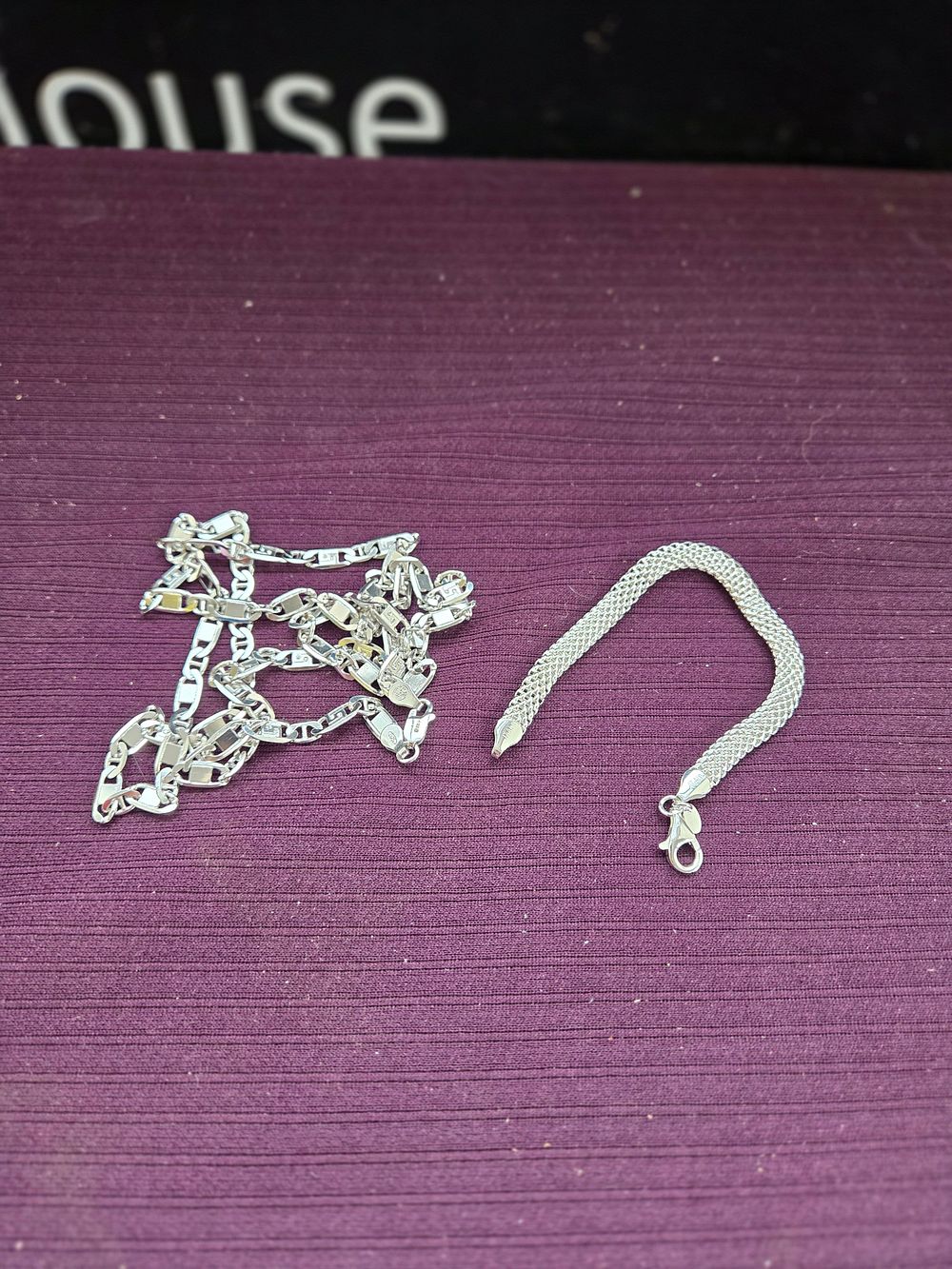 Lot 639 – Two sterling silver chains comprising a woven mesh and an anchor link design 33.45g