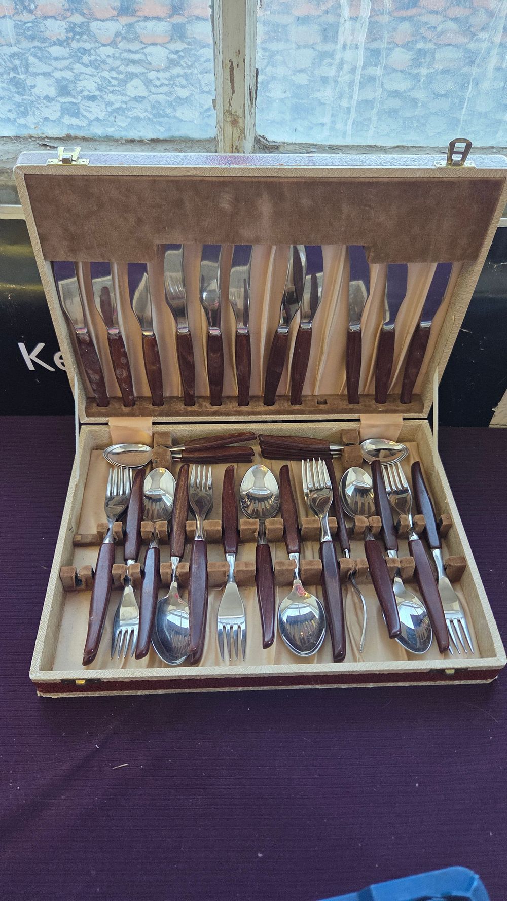Lot 155 – A Set of Mid-Century Modern Stainless Steel and Wood Handle Flatware