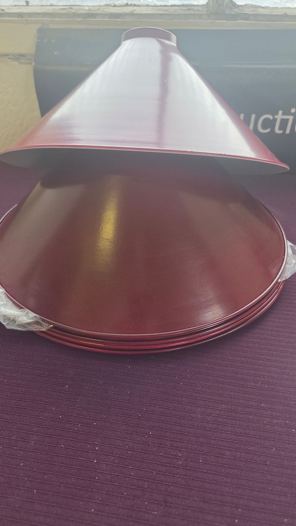 Lot 202 – A Set of Five Maroon Enamelled Metal Conical Lamp Shades