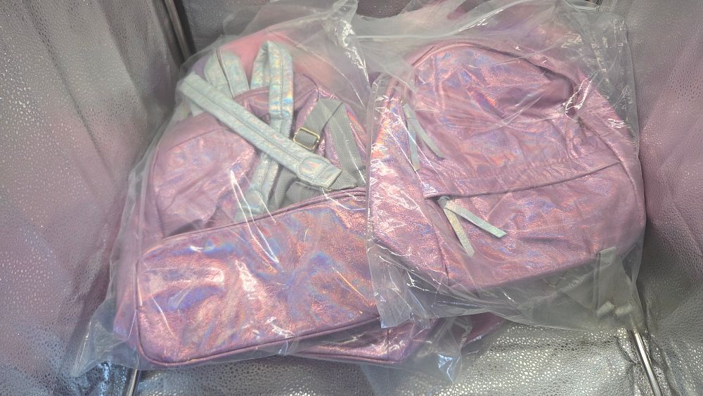 Lot 314 – Seven New Pink Holographic Fashion Backpacks