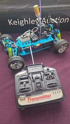 An Acme Racing Condor 1/10 Scale Nitro Powered RC Buggy with Transmitter and Accessories