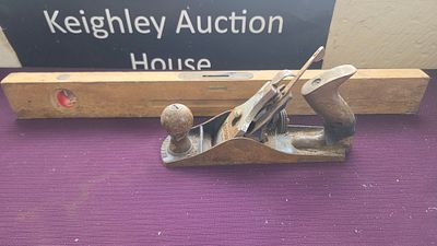 Two Vintage Hand Tools Comprising a Record No. 04 Smoothing Plane and a Wooden Spirit Level