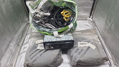 A Collection of Electronics including a Car Stereo and Ethernet Cables