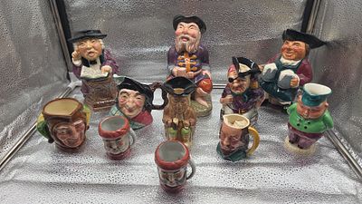 A Collection of English Character Jugs and Figurines in the Style of Royal Doulton