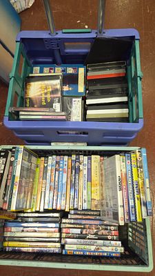 Two Boxes of Assorted Home Media including DVDs, CDs, and VHS Tapes