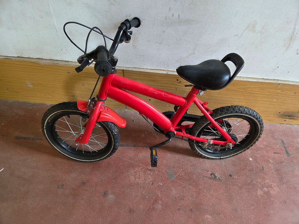 Lot 418 – A Red Fourteen Inch Childrens Pedal Bicycle