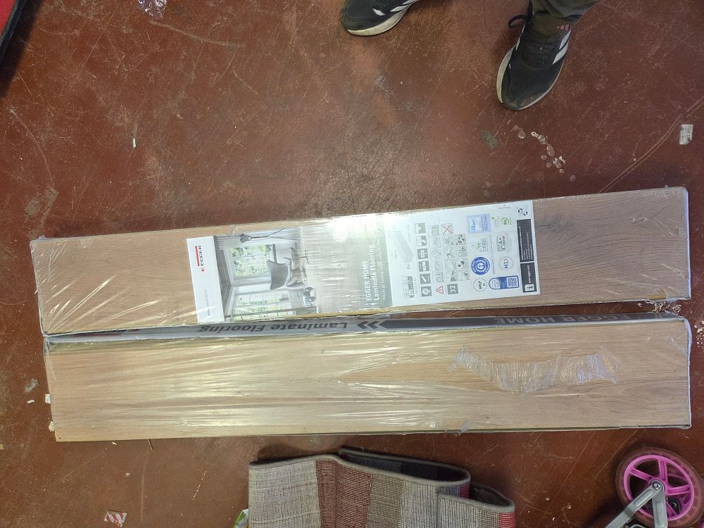 Lot 439 – A Lot of Two Packs of EGGER HOME Light Wood-Effect Laminate Flooring Approx 3 Square Meters