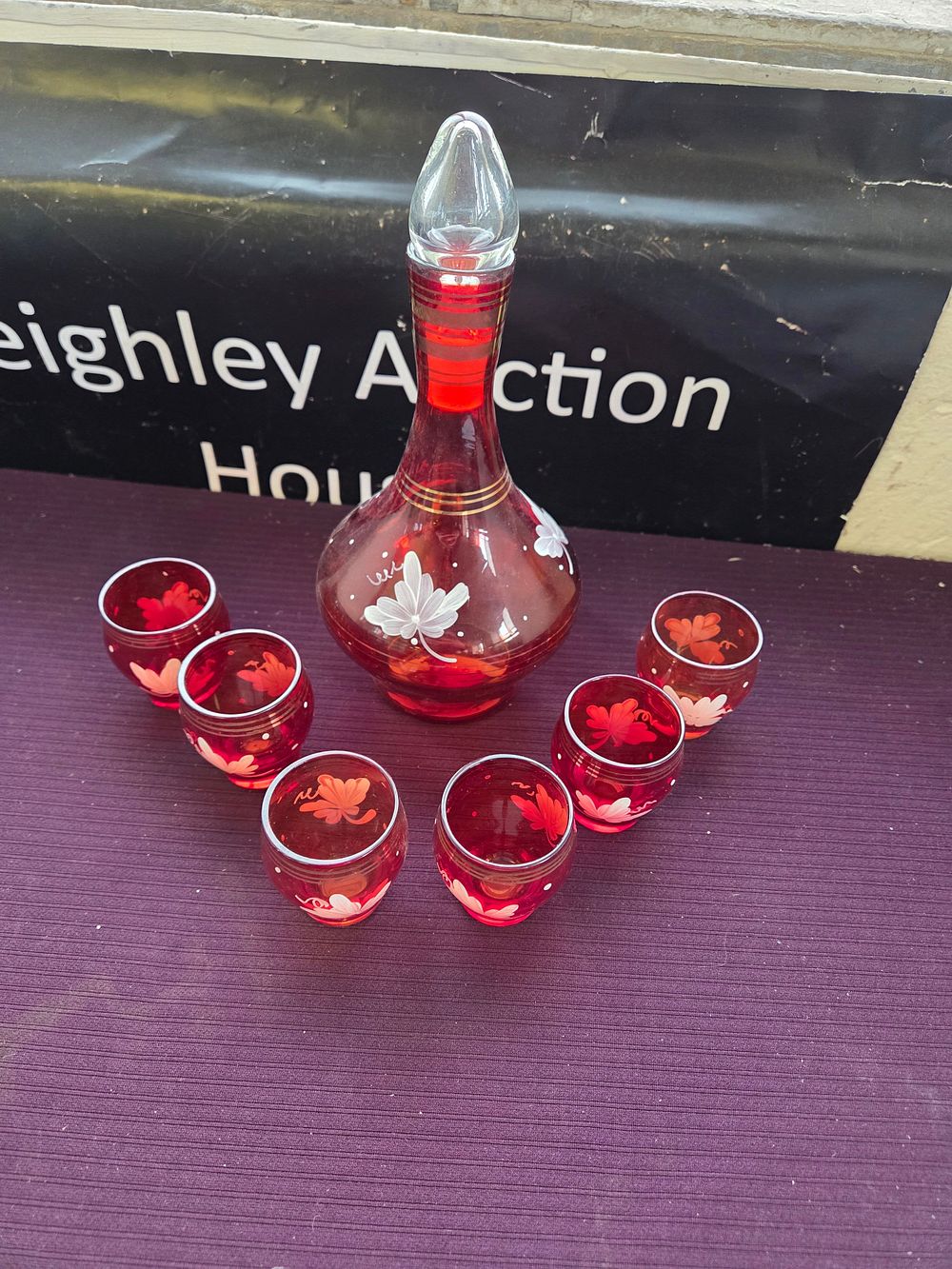 Lot 603 – A Set of Bohemian Ruby Red Enamelled Glass Liqueur Wares