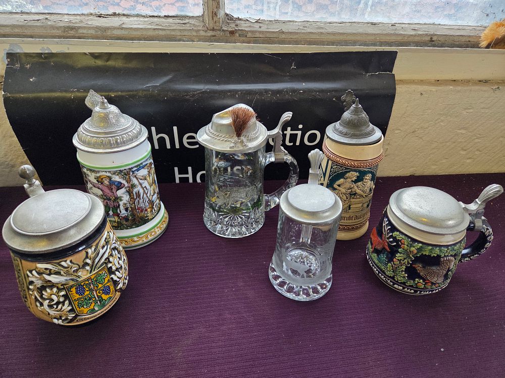 Lot 611 – A Set of Six Assorted German Style Lidded Beer Steins