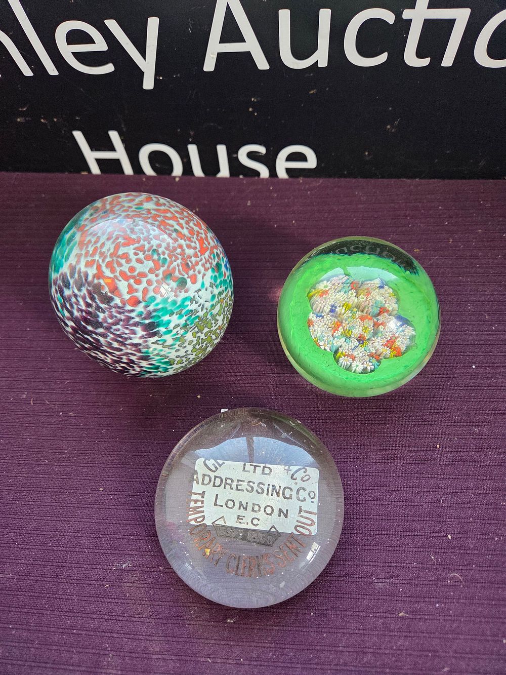 Lot 625 – A Trio of Glass Paperweights Including Millefiori and Advertising Examples
