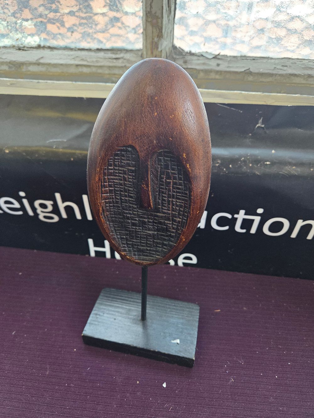 Lot 630 – A Carved Coco de Mer Style Nut on a Minimalist Stand