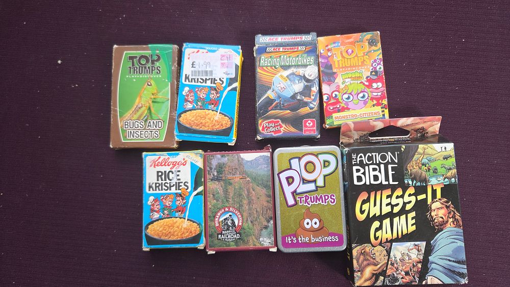 Lot 172 – A Collection of Assorted Card Games Including Top Trumps and The Action Bible
