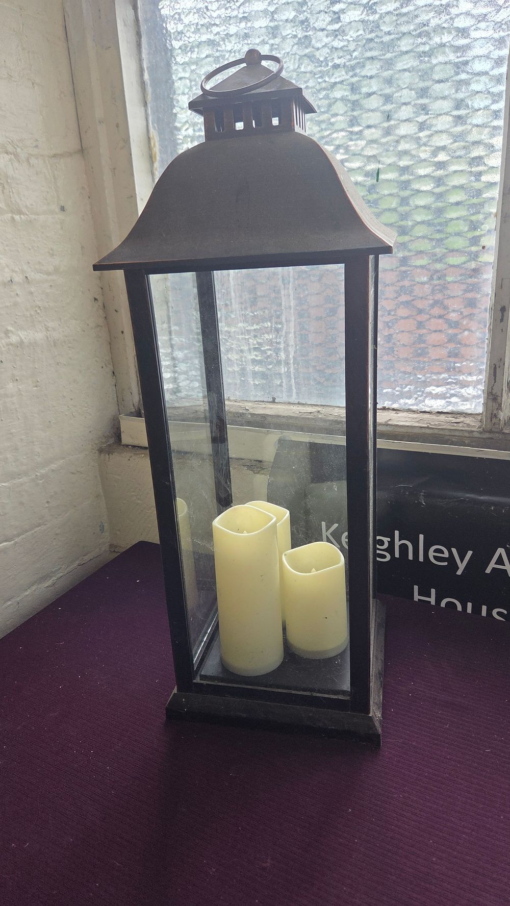 Lot 192 – A Contemporary Metal and Glass Floor Lantern with Flameless LED Candles
