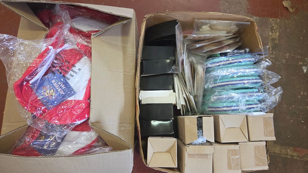 Lot 261 – Two Boxes of New Mixed Wholesale Goods Including Seasonal Headwear, Pouches, and Gift Boxes