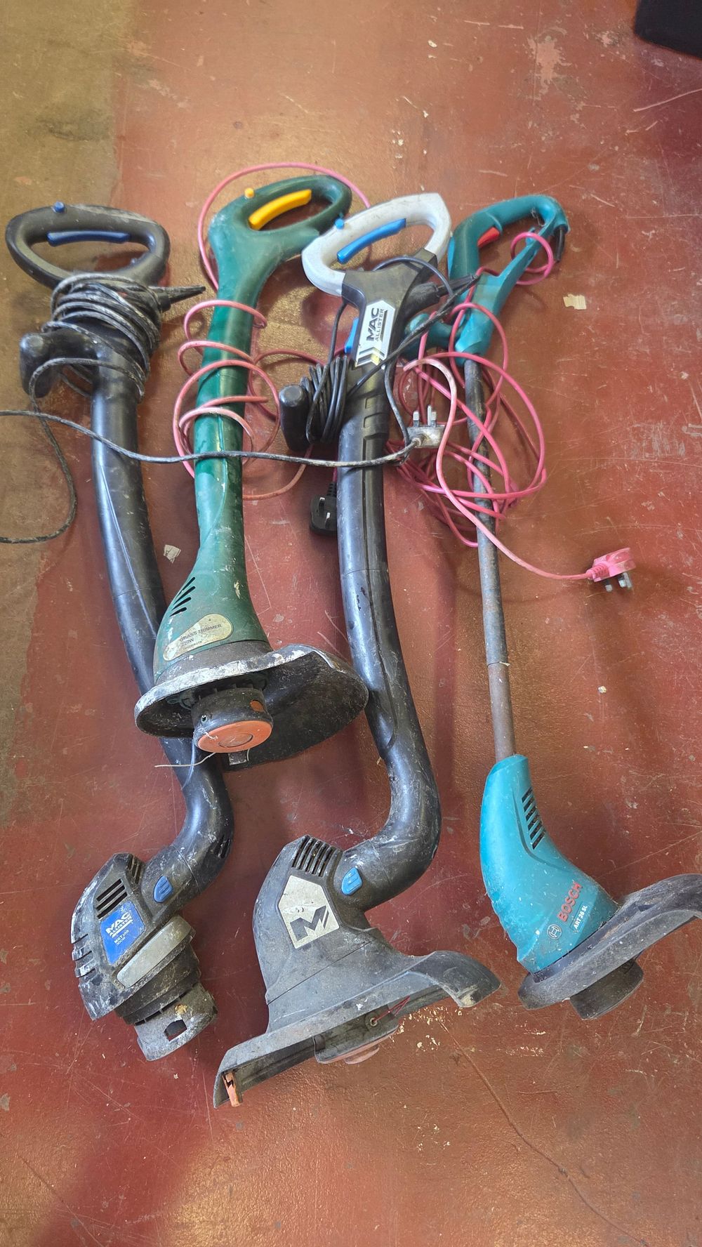 Lot 278 – Four Assorted Corded Electric Grass Trimmers Including Bosch and Mac Allister Models all power on