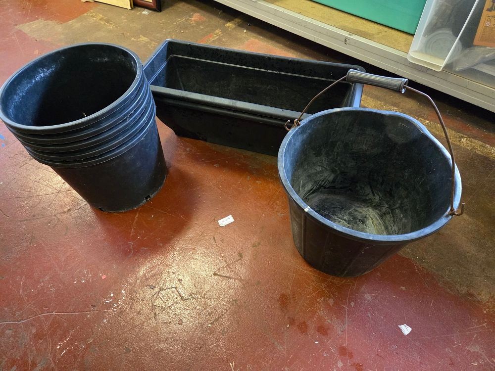 Lot 303 – An Assortment of Black Plastic Gardening Containers and a Utility Bucket