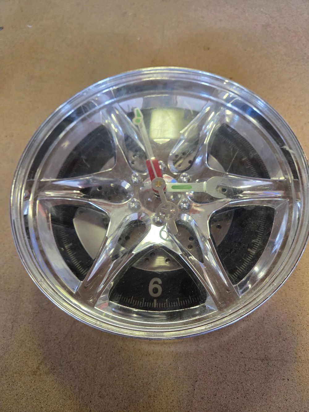 Lot 308 – An Automotive Themed Novelty Alloy Wheel Wall Clock