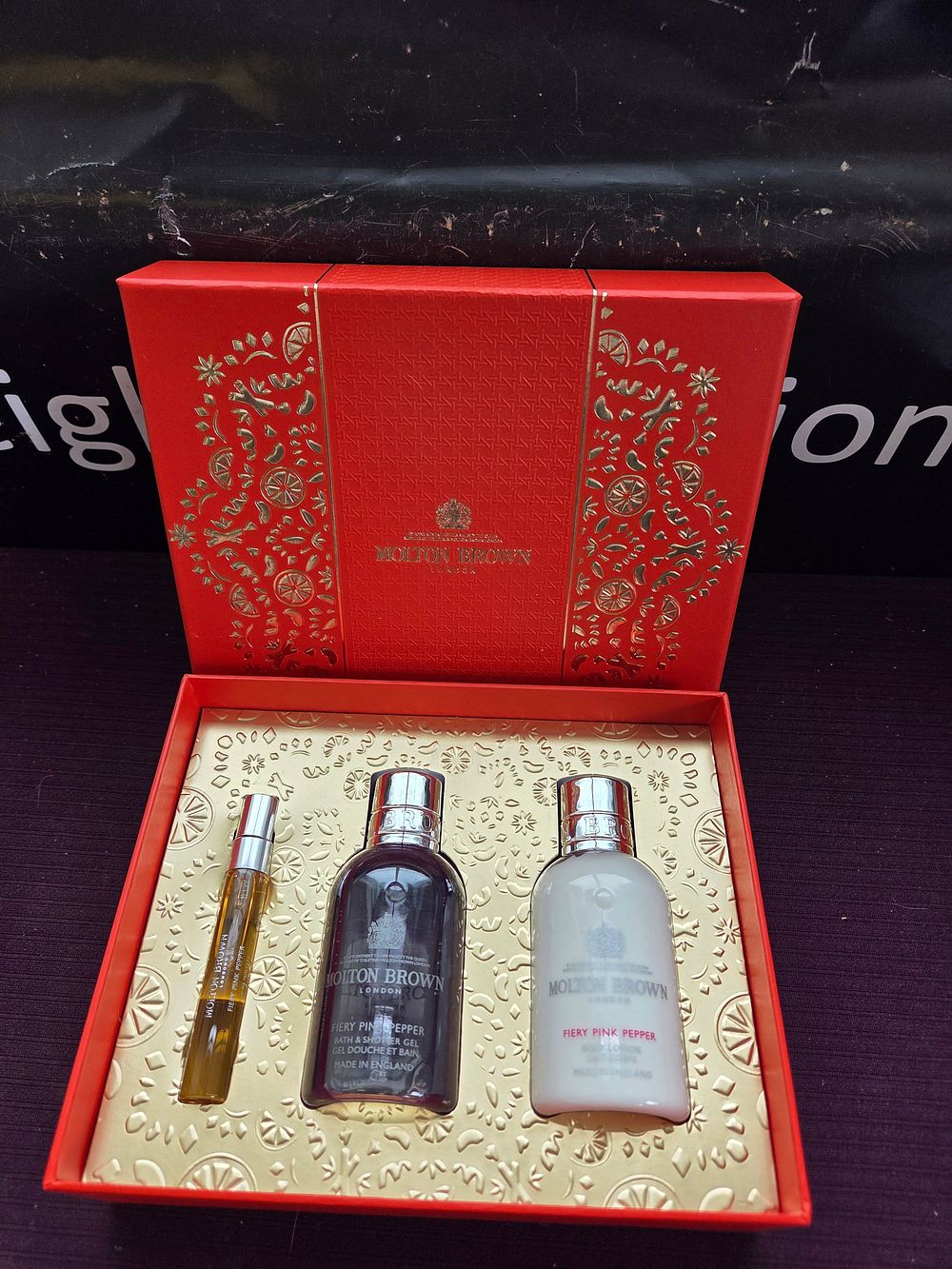Lot 316 – A Molton Brown Fiery Pink Pepper Three-Piece Gift Set