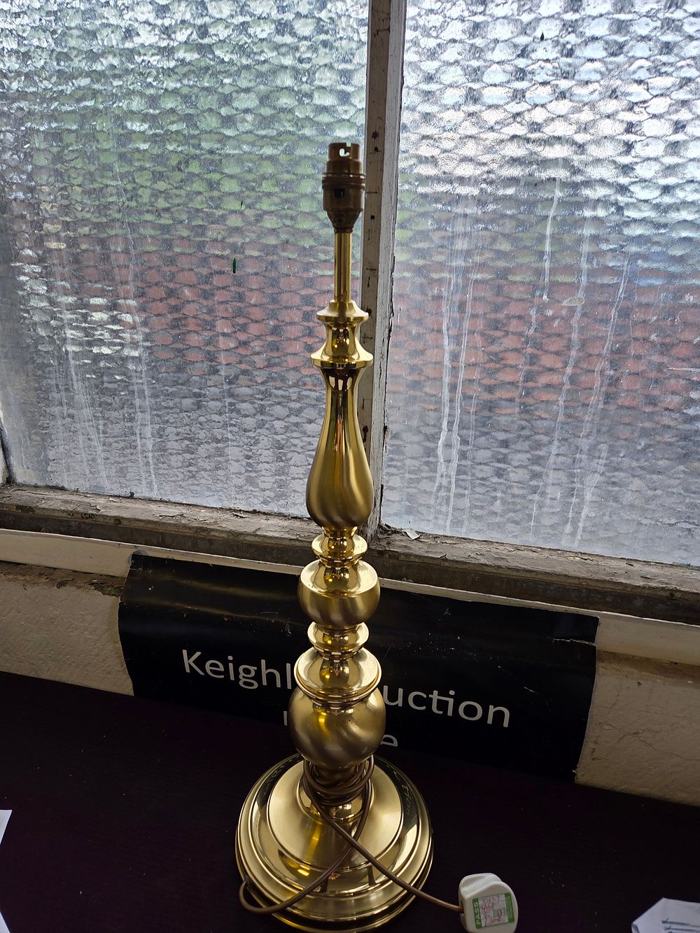 Lot 332 – A polished brass baluster form table lamp base in the style of Stiffel
