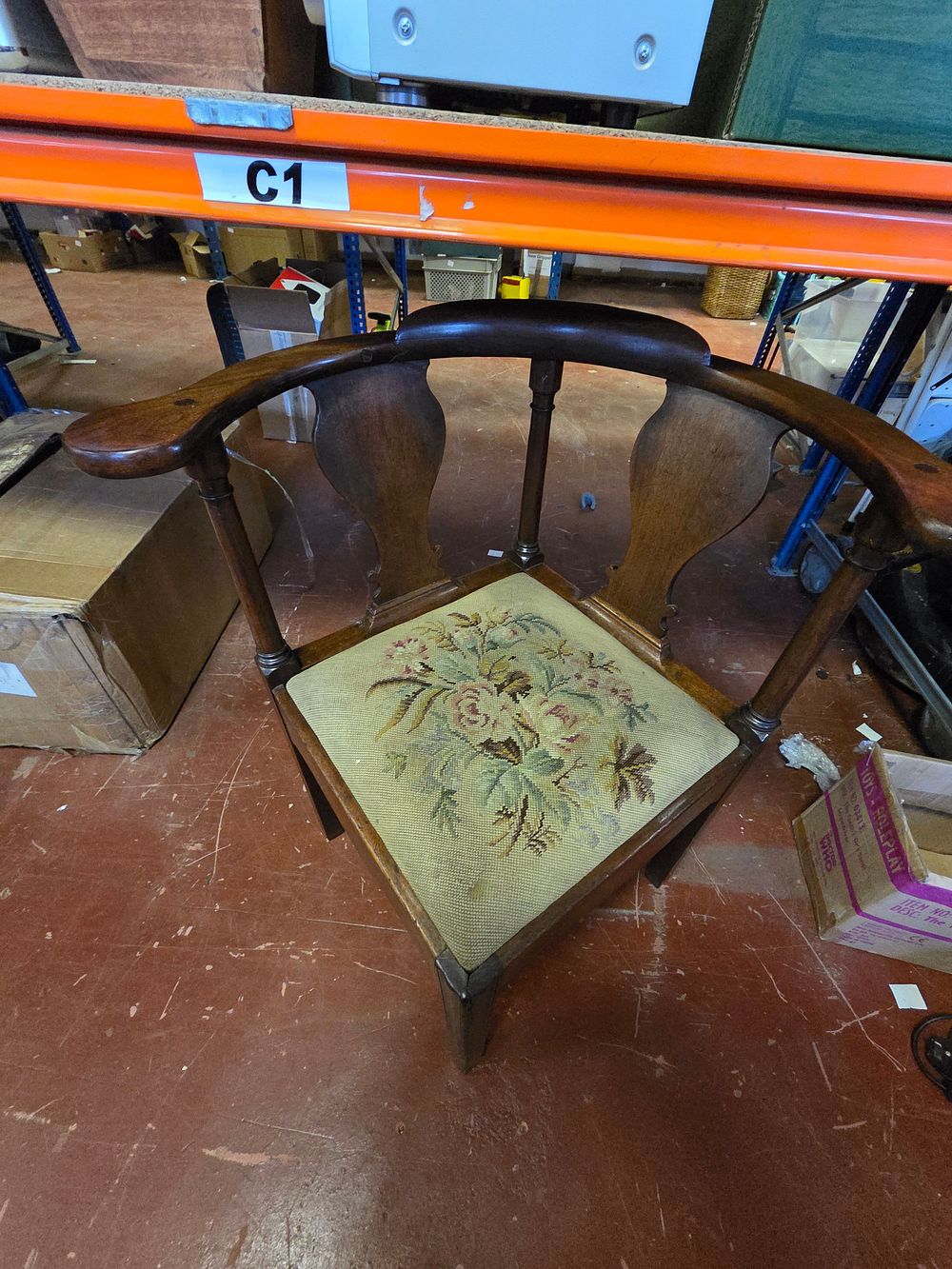 Lot 340 – A George II style mahogany corner chair with floral needlepoint seat