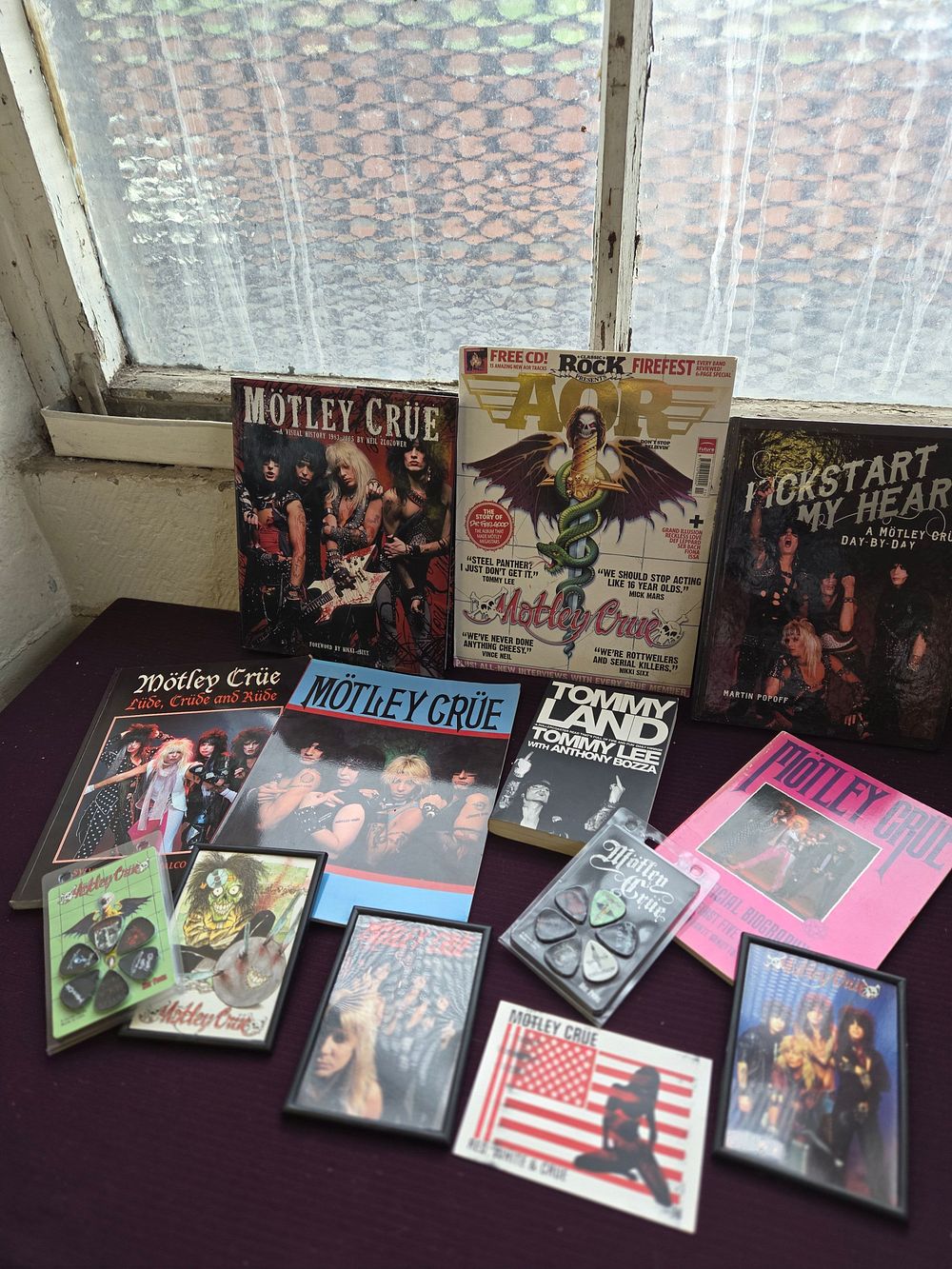 Lot 347 – A Collection of Mötley Crüe Memorabilia including Books, Magazines and Ephemera