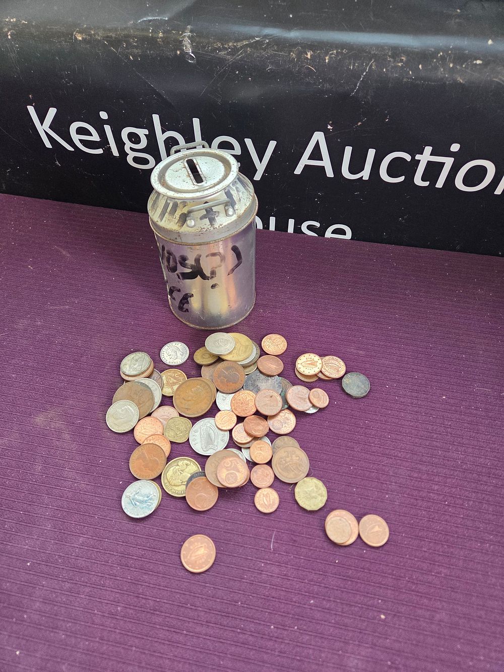 Lot 600 – A Collection of UK and World Coins with a Novelty Milk Churn Money Box