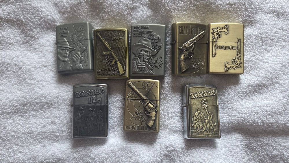 Lot 626 – A Collection of Western and Firearm Themed Windproof Lighters in the Style of Zippo