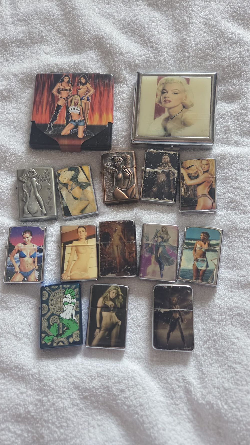 Lot 632 – A Collection of Fourteen Smoking-Related Collectibles Including Twelve Petrol Lighters and Two Cigarette Cases