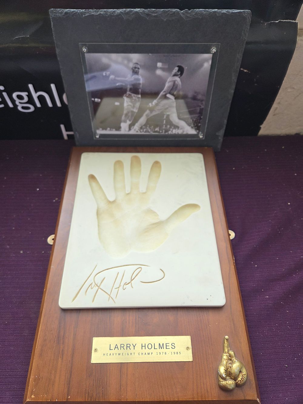 Lot 645 – Two Larry Holmes Boxing Memorabilia Items Including Hand Cast Plaque and Framed Photograph