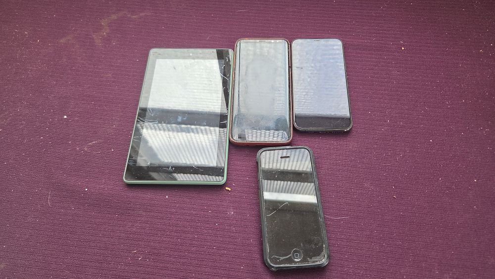 Lot 151 – A Collection of Electronic Devices including an Amazon Fire Tablet and Three Smartphones
