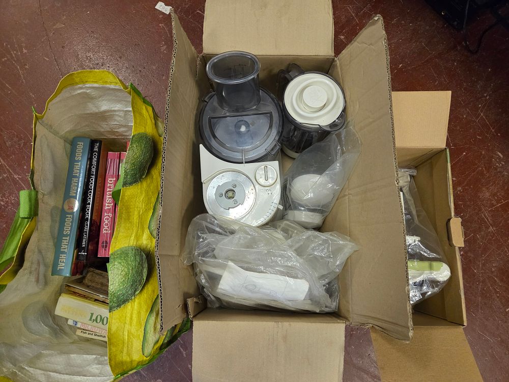 Lot 302 – A Kenwood mixer with Attachments w/o, a Manual Slicer, and Cookbooks
