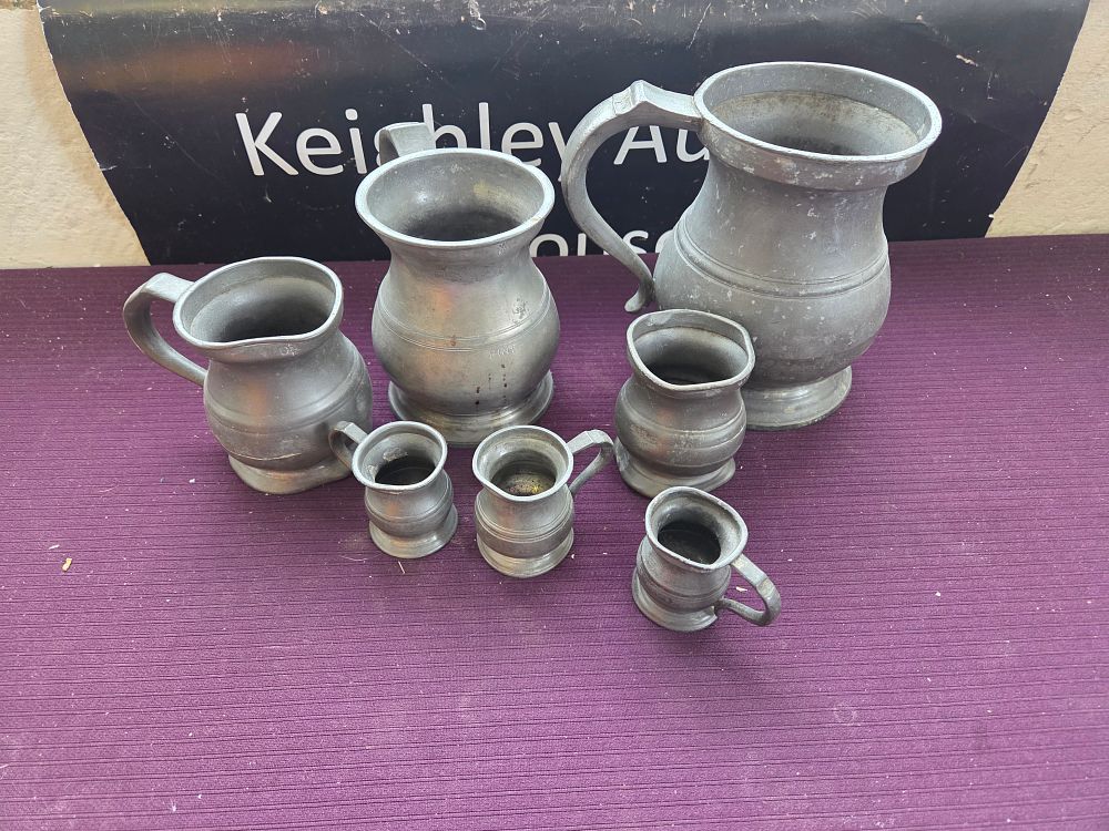 Lot 307 – A Collection of Graduated English Pewter Tavern Measures and Jugs