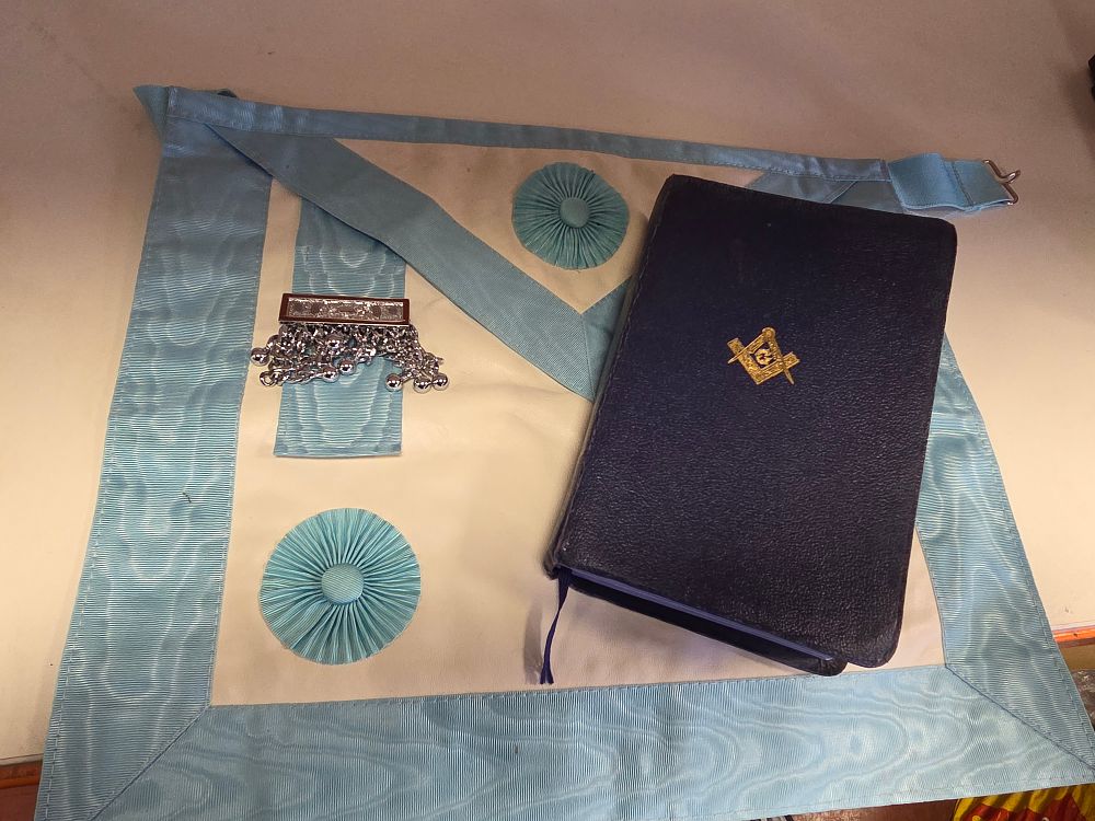 Lot 319 – Masonic Items Comprising a 2 Master Mason’s Aprons and a Leather-Bound Volume of the Sacred Law
