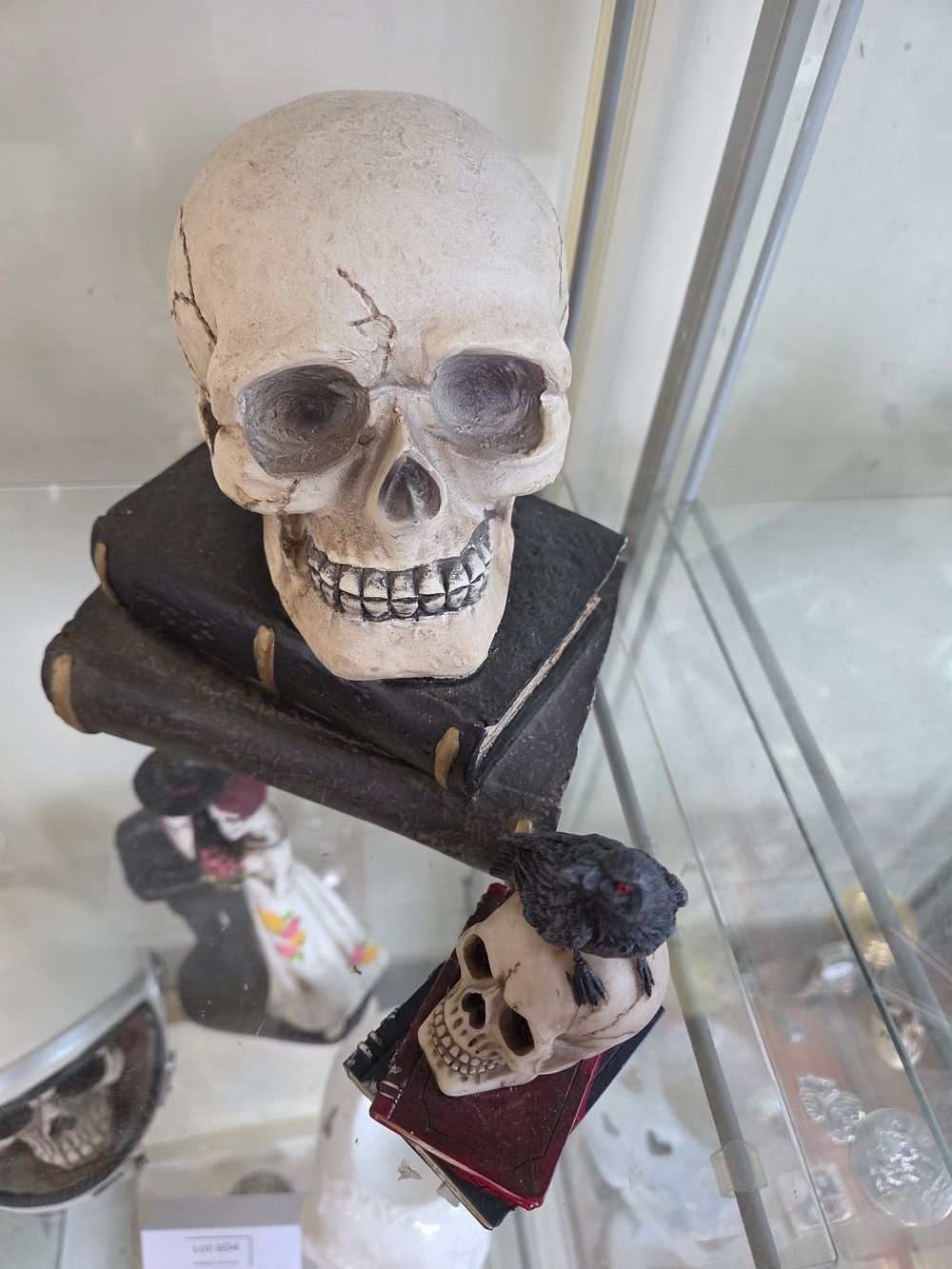 Lot 603 – Two Gothic-Style Resin Skull and Book Decorative Ornaments