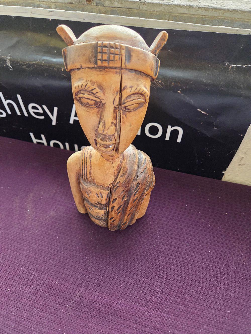 Lot 629 – A Carved Wooden Stylised West African Bust with Pyrographic Detailing