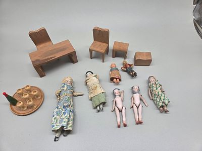 An Assortment of Antique Miniature Dolls and Rustic Wooden Dollhouse Furniture