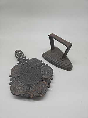 Two Antique Cast Iron Items comprising a No. 5 Sad Iron and a Commemorative Royal Arms Trivet