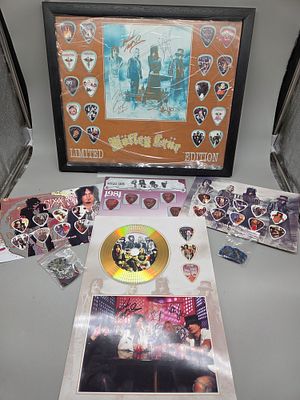 A Collection of M&ouml;tley Cr&uuml;e and Sixx:A.M. Signed Memorabilia and Guitar Pick Displays