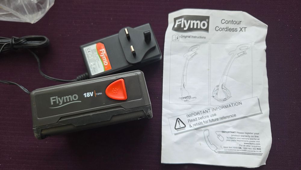 Lot 311 – Flymo 18V 1.6Ah Battery, Charger, and Instruction Manual