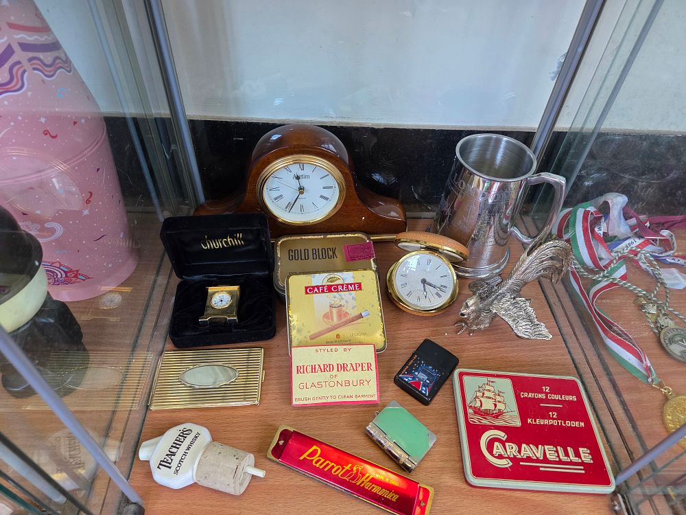 Lot 649 – An Assortment of Vintage Collectables including Clocks, Advertising Tins, and Smoking Accessories