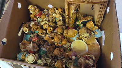 A collection of hand-painted rabbit figurines and display stands, attributed to Pendelfin