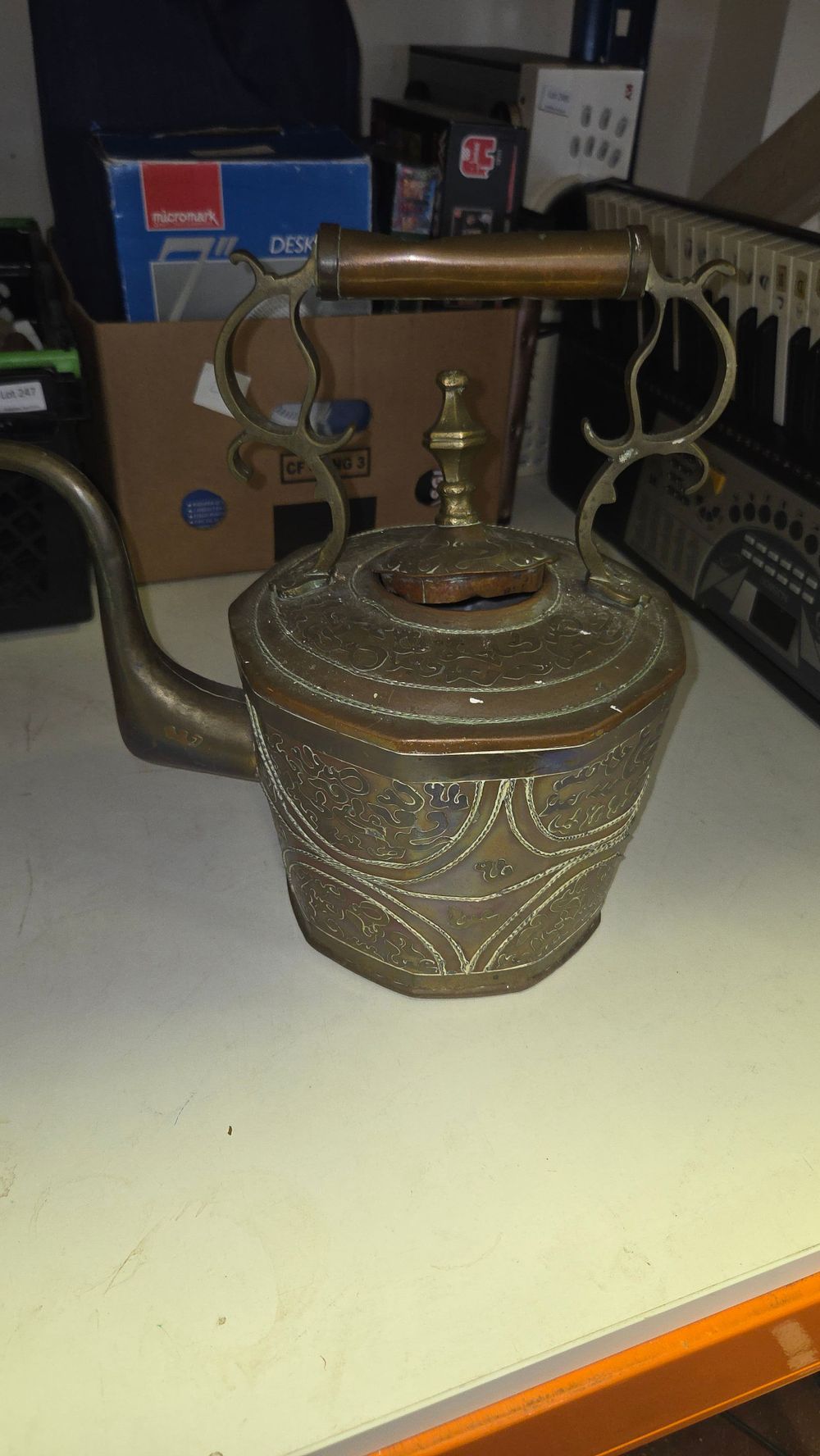 Lot 251 – An Islamic-Style Engraved Copper and Brass Octagonal Kettle