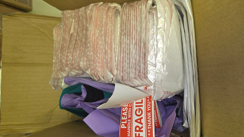 Lot 285 – An Assortment of New Shipping and Packaging Supplies Including Bubble Mailers, Poly Mailers, and Labels