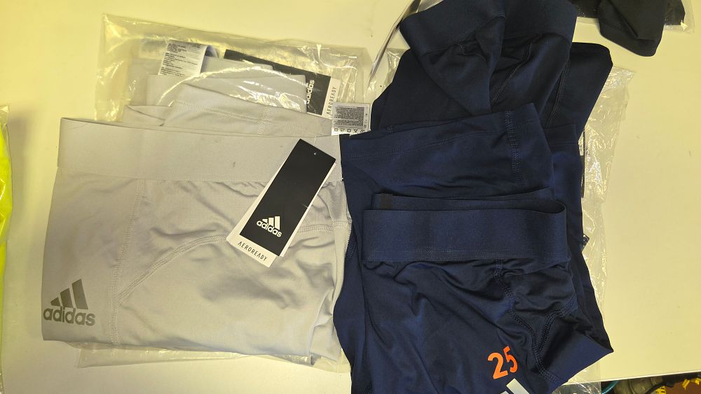 Lot 290 – A Group New of Adidas Athletic Compression Shorts and Base Layers Various Sizes