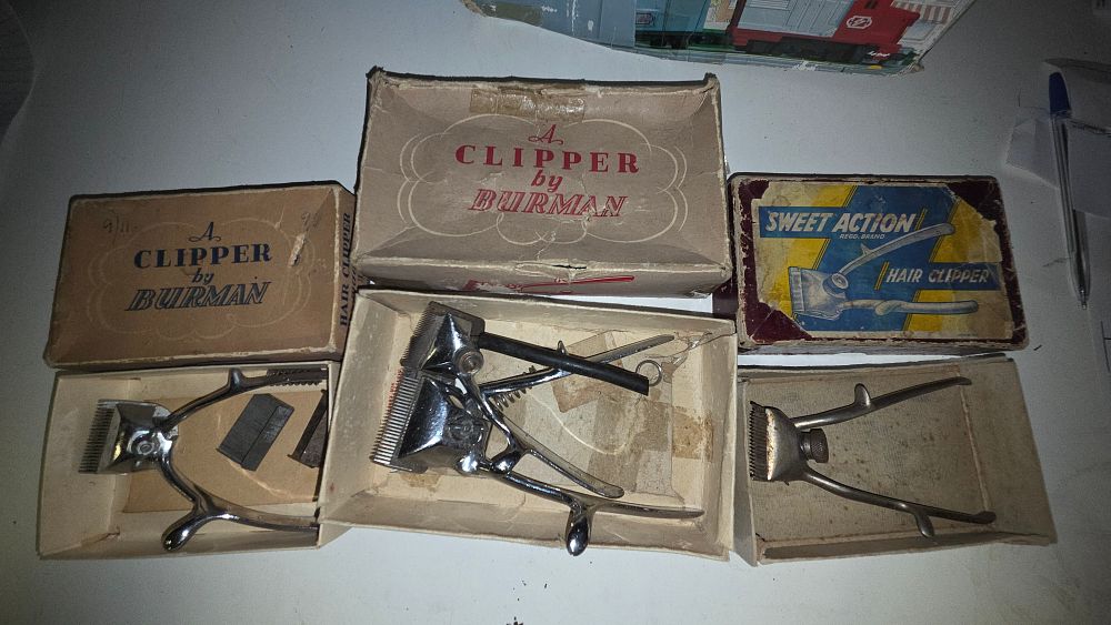 Lot 293 – A Trio of Vintage Manual Hair Clippers by Burman and Sweet Action with Original Boxes