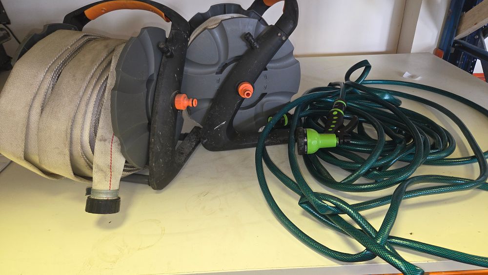 Lot 304 – A Collection of Manual Hose Reels and Garden Hoses