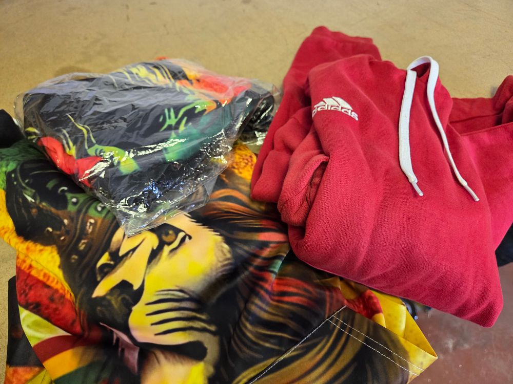 Lot 328 – A Trio of Contemporary Casual Garments Including an Adidas Hoodie and Rastafarian Graphic Apparel XL/2XL