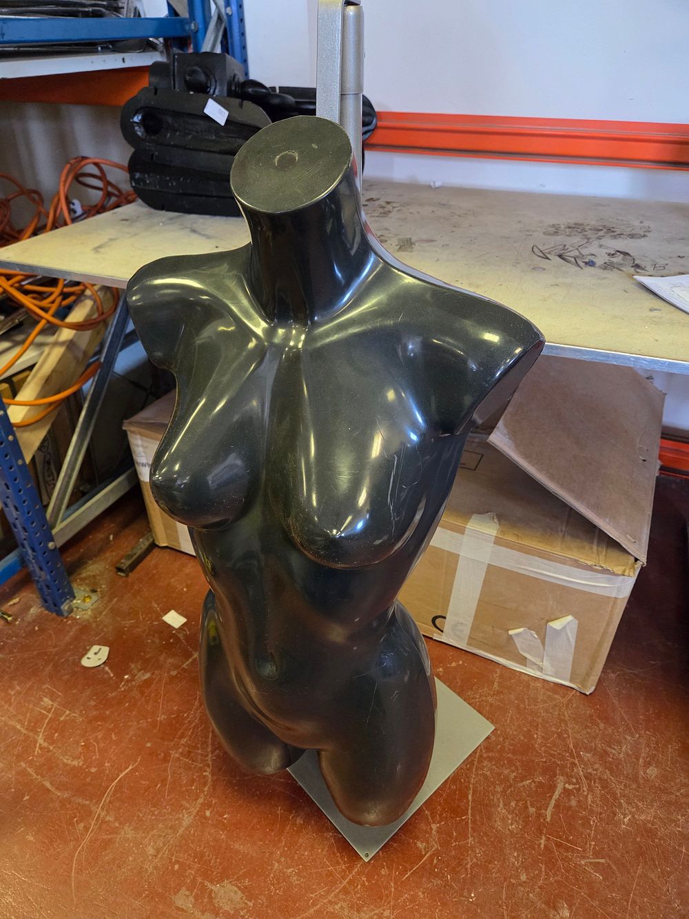 Lot 345 – A contemporary female mannequin torso in high-gloss black finish o Stand