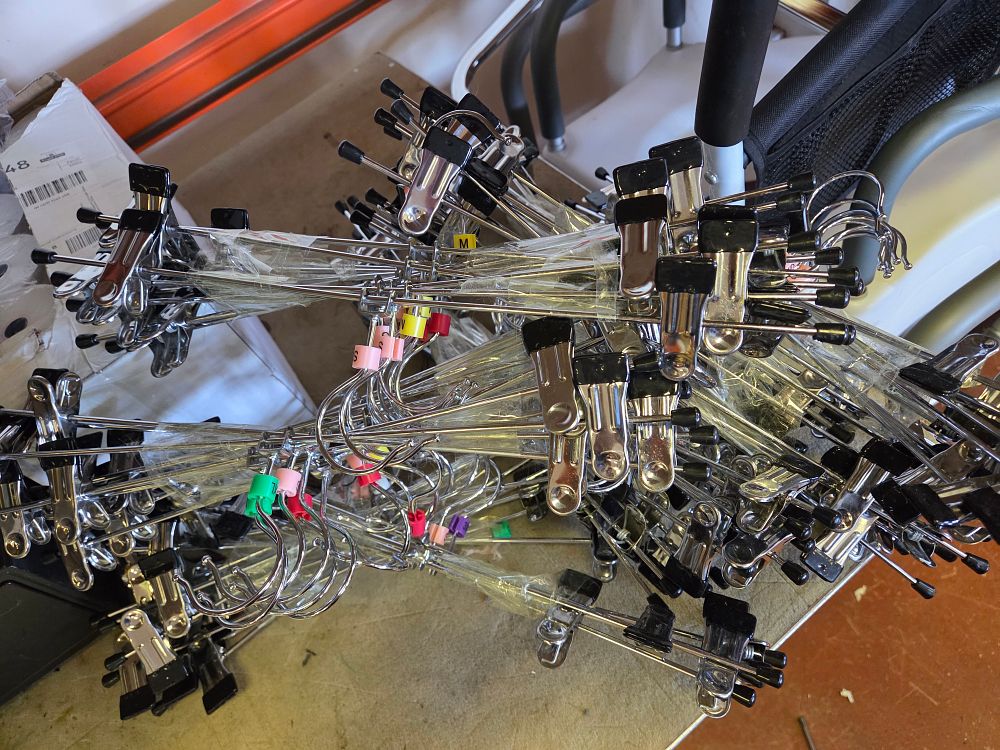 Lot 347 – A Large Collection of Commercial Metal Clip Hangers for Trousers and Skirts