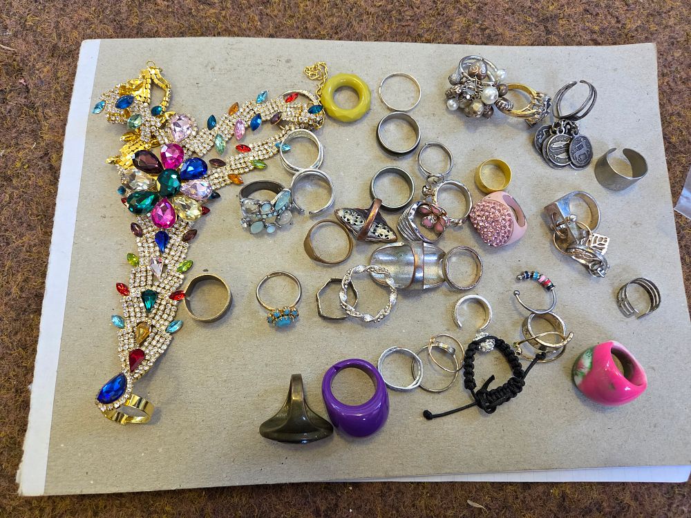 Lot 654 – An Assortment of Costume Jewellery Rings and a Gem-Set Slave Style Jewel